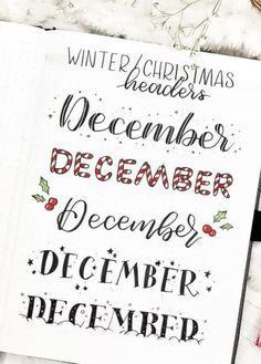 an open notebook with christmas lettering on it and the words december written in cursive writing