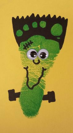 a drawing of a green monster with big eyes