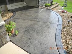 a concrete patio in front of a house