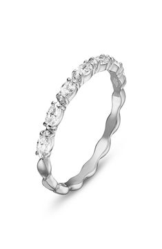 A row of marquise-shaped Swarovski crystals add timeless sparkle to this dainty band that can be stacked or worn alone. 1/8" band width Swarovski crystal/rhodium plate Imported White Gold Cubic Zirconia Marquise Cut Eternity Band, Marquise Cubic Zirconia Half Eternity Jewelry, Marquise Cut Cubic Zirconia Half Eternity Band, Cubic Zirconia Marquise Cut Half Eternity Band, Marquise Cut Half Eternity Band In Cubic Zirconia, Silver Marquise Half Eternity Ring, Anniversary Marquise Stackable Rings, Marquise Stackable Rings For Anniversary, Anniversary Stackable Rings With Marquise Cut