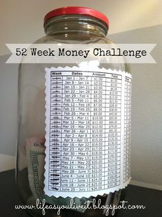 a jar full of money with the words 52 week money challenge written on it in red