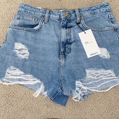 Light-Medium Wash Denim Shorts With Rips Forever 21 High-waisted Blue Jean Shorts, Forever 21 Blue Jean Shorts, Forever 21 Blue High-waisted Shorts, Forever 21 Blue Cutoff Shorts, Forever 21 Blue Summer Bottoms, Blue Summer Bottoms From Forever 21, Forever 21 Light Wash High Rise Bottoms, Forever 21 Light Wash Casual Jean Shorts, Forever 21 High Rise Light Wash Bottoms