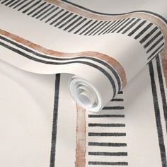 a white and black striped wallpaper with an orange stripe on the bottom right corner