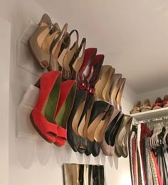 an image of shoes hanging on the wall using crown molding to store them for sale