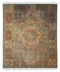 an antique rug with various colors and patterns