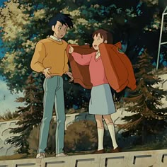 a man and woman standing next to each other in front of trees