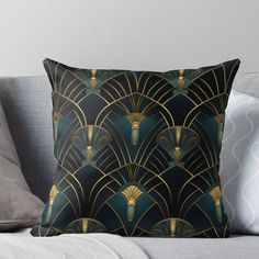 a black and gold art deco design throw pillow