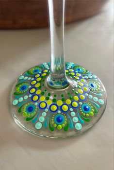 a wine glass sitting on top of a table