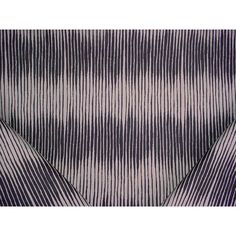 an image of a black and white tie with lines on the fabric, as if it were made from silk