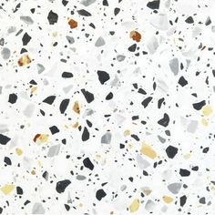 white and black speckled paper with gold foil on the bottom, in different colors