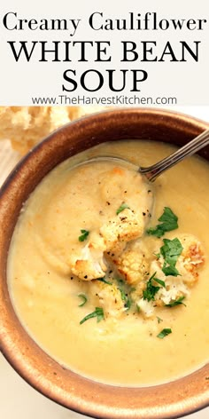 creamy cauliflower white bean soup in a brown bowl