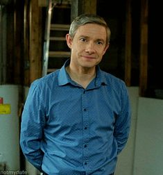 a man standing in front of a refrigerator