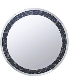 a round mirror with black and white dots on it