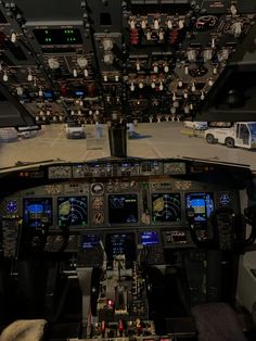 the cockpit of an airplane with many instruments