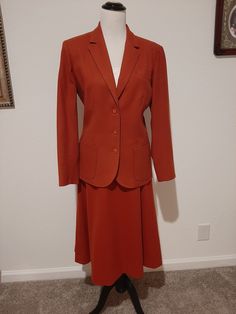 "Vintage Womens Pendleton Wool Rust Wool Skirt Suit Size L Made By Pendleton Very Good Vintage Condition.  No Rips, Tears Or Stains. Pea Sized Worn Spot On Upper Right Back Shoulder. Stored Well And Very Clean. Marked Size 14 But May Fit 12-14 Today.  Please Check Measurements 2 Piece Rust High Waist Lined Skirt Suit Fully Lined A Line Skirt With 1\" Narrow Waistband 7.5\" Rust Nylon Back Zipper Darted In Front And Back Below Knee Length Lined Blazer With 3 Buttons Front And 3 On Each Cuff 2 Fro Classic Semi-formal Skirt For Fall, Classic Semi-formal Fall Skirt, Classic Spring Skirt Suit With Buttons, Retro Formal Skirt Suit With Buttons, Fitted Buttoned Formal Skirt, Fitted Skirt Suit With Pockets For Fall, Formal Fitted Skirt With Buttons, Tailored Fall Skirt Suit With Pockets, Fall Workwear Skirt Suit With Lined Skirt