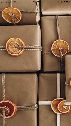 presents wrapped in brown paper with orange slices on them