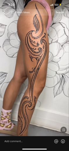 a woman's legs with an intricate tattoo design on the thigh and lower leg