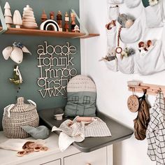 a baby's crib is shown with toys on the shelves and in front of it