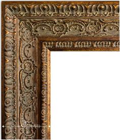 an ornate wooden frame with intricate carvings on the edges and sides, against a white background