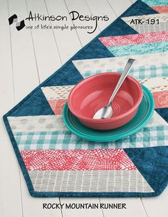 a place mat with a bowl and spoon on it