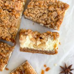 several pieces of dessert sitting on top of a white paper towel next to star anise