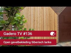 a wooden building with a red sign that says gadero tv 138 open gevelbedding siersch larkks