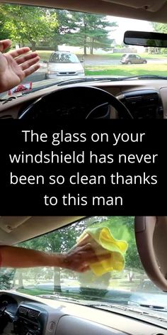 someone cleaning the inside of a car with a yellow cloth on it's windshield