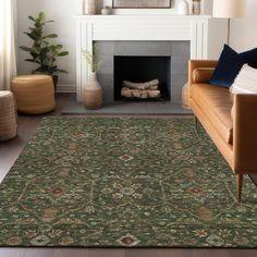 a living room with a couch, fireplace and rug in the middle is decorated with various types of decorative items