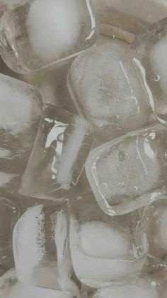 some ice cubes are sitting on top of each other in the middle of a pile