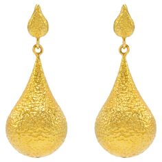 The Bali 20k Gold hand hammered, one of a kind earrings are like wearing royalty! The luxurious color of the gold complimented with the perfect amount of hammering is ideal for day or night. The vibe here is make a wish and watch the magic happen. Spectacular to elevate your style day or night! Unparelleled luxury! The Essentials Collection is the ultimate in ease and beauty. Effortlessly transitions from day to night. These are the foundational pieces that all other collections were born. 20k gold, hand made and textured with a gorgeous hand hammered finish. Deliberately made to add on and pair with all Tagili collections. These are the staple pieces for an easy going vibe yet highly glamorous style. The Tagili Promise: With every purchase a portion of the proceeds goes to a local woman's Luxury Hammered Earrings For Anniversary, Luxury Hammered Drop Earrings, Luxury Hammered Gold Earrings, Hammered Teardrop Earrings For Formal Occasions, Luxury 22k Gold Earrings For Formal Occasions, Elegant Hammered 22k Gold Earrings, Formal Teardrop Hammered Jewelry, 22k Gold Teardrop Earrings For Formal Occasions, Hammered Dangle Earrings For Formal Occasion