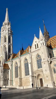 a large cathedral with many windows and towers