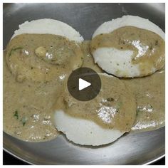 an image of food being cooked in a frying pan with gravy on top