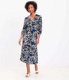 This beautifully streamlined fluid woven midi dress gets tied up at front with effortless glam. V-neck. Long blouson sleeves with puff shoulders and elasticized cuffs. Tie waist. Side slit. Back zip.,Hit:Hit: Midi - Hits at mid-calf,Imported:Imported,Fit:Fit: Waisted - fits and flatters waist,Length:43 1/2" from top back neck to hem, measured from a size 8/M,Fabrication:90% Rayon 10% Nylon,Garment Care:Machine Washable Loft Petite Leafed Tie Front Midi Dress Size 12 Deep Space Blue Women's by Lo Petite Midi Dress, Petite Curvy, Petite Shirts, Exclusive Clothing, Petite Jacket, Petite Pants, Dress Home, Petite Tops, Deep Space