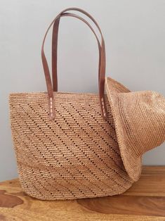 Crochet tote basket, summer basket, raffia crochet bag, crochet straw bag, beach bag, beach basket Large Crochet Raffia Bag -Composition: 100% natural raffia from Madagascar -Handle: 100% Leather -Lining: 100% Cotton -Dimensions: 36cm×48cm The bag closes with a zipper Interior lined in cotton canvas with one patch pocket. Magnificent bag entirely handmade. A tote bag, a bag that easily matches any outfit. Due to handwork and the nature of raffia, there may be slight differences in measurement or Bohemian Straw Bag For Beach Season Shopping, Casual Summer Straw Bucket Hat, Bohemian Crochet Bag For Beach Shopping, Handmade Bucket Bag For Summer Shopping, Bohemian Bucket Crochet Bag For Vacation, Bohemian Crochet Bucket Bag For Vacation, Natural Handwoven Bucket Bag For Beach Season, Handmade Summer Shopping Bucket Bag, Handwoven Natural Bucket Bag For Beach Season