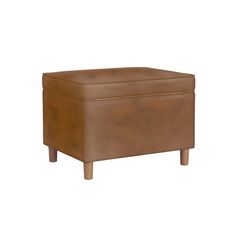 Our classic Dinah storage ottoman is designed with function and fashion in mind. Enjoy this simple shape in a smaller space or pair two together for a seating statement at the end of a bed or around a living room. Made with a durable Dark Brown faux leather and wood legs in a Honey Oak finish, along with soft-close safety hinges, this ottoman is easy to assemble and easily spot-cleaned. Overall Height: 18 inches Overall Depth: 18 inches Overall Width: 24 inches Square Storage Ottoman, Leather Storage Ottoman, Round Storage Ottoman, Leather And Wood, Honey Oak, Cube Ottoman, Round Storage, Ottoman In Living Room, Cushion Filling