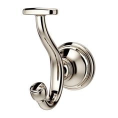 a chrome plated hook on the wall with a curved handle and two round knobs