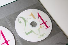 two dvd's with numbers on them sitting next to each other