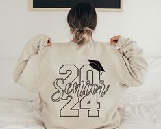 Standard Fit Personalized Senior 2024 Sweatshirt, Custom Class of 2024 Sweatshirt, College Grad Sweater, School Graduation Unisex Crewneck Sweatshirt 8.5 Oz./Yd² (Us) 14.1 Oz./L Yd, (CA), 80/20 Cotton/Polyester Blend Fleece Solid Colors & Gunmetal Heather: 80/20 Cotton/Polyester With 100% Cotton 20 Singles Face Yarn Grey Heather: 75/25 Cotton/Polyester All Other Heather Colors: 55/45 Cotton/Polyester (Charcoal Heather, Classic Navy Heather, Royal Heather, Army Heather) Split Stitch Double Needle Graduation Sweatshirts Ideas, Grad Wear Hoodies, Seniors Hoodie Design, Grad Hoodies Design, Senior Sweaters, Grad Hoodies, Seniors Sweatshirt, Senior Sweatshirts Ideas, Senior Class Hoodie Design