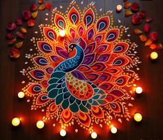 an artistically painted peacock surrounded by candles on a wooden floor with petals scattered around it