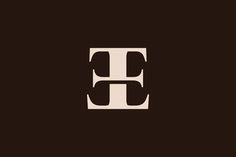 the letter e is made up of black and white letters on a dark brown background