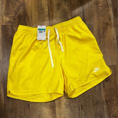 Mens Nike Woven Lined Flow Shorts It's Officially Shorts Season! Get In The Spirit With These Lightweight Woven Lined Flow Shorts From Nike Sportswear. Nike Embroidery At Hem Side Pockets Elastic Waistband With Adjustable Drawstring Back Pocket Inner Lining Lightweight Polyester Material Color Shown: Yellow Style: #Dm6829-731 Yellow Leisure Bottoms For Summer, Casual Yellow Shorts For Leisure, Yellow Bottoms With Elastic Waistband For Streetwear, Sporty Yellow Swim Trunks Short Length, Sporty Yellow Swim Trunks, Sporty Yellow Short Swim Trunks, Nike Yellow Sport Bottoms, Yellow Casual Short Swim Trunks, Casual Yellow Short Swim Trunks