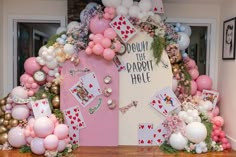 a table topped with lots of balloons and cards