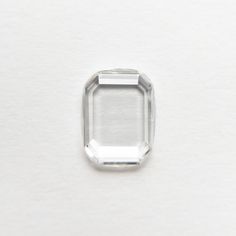 an oval cut diamond on a white surface with the center piece missing from it's face