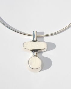 This striking modernist collar features a bold pendant of stacked forms on a clean sterling silver collar. Available in solid brass or sterling silver on an 18" sterling silver collar. Collar closes with a button clasp. Availablility: Currently in stock and ready to ship. Clean Sterling Silver, Traditional Crafts, Jewelry Inspo, Modern Classic, Custom Jewelry, Chains Necklace, Solid Brass, Monument, Jewelry Making