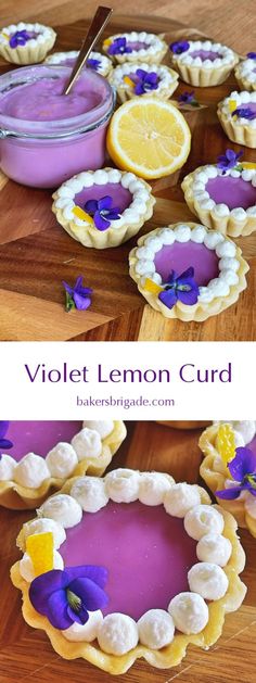 violet lemon cupcakes on a wooden cutting board with purple icing and flowers