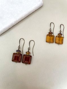 Beautiful fall Czech glass earrings Options: Mustard yellow Brown Length  Approximately 1.75 inches long Amber Czech Glass Dangle Earrings, Granola Earrings, Vintage Orange Earrings With Czech Glass, Vintage Orange Czech Glass Earrings, Nickel Free Brown Earrings With Czech Glass, Amber Czech Glass Earrings With Ear Wire, Nickel-free Brown Earrings With Czech Glass, Bohemian Glass Drop Earrings, Amber Czech Glass Drop Earrings