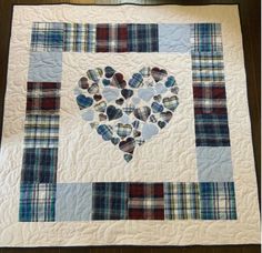 a heart made out of hearts on a quilt