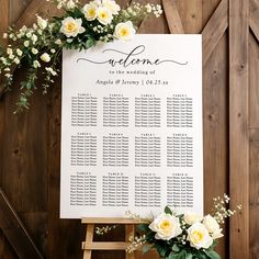 a wedding seating chart with flowers on it