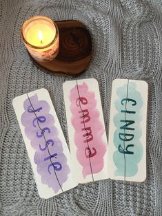 three cards with the words change on them next to a candle