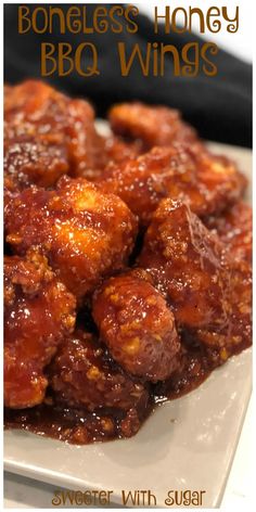 honey bbq wings on a white plate with the words, boneless honey bbq wings